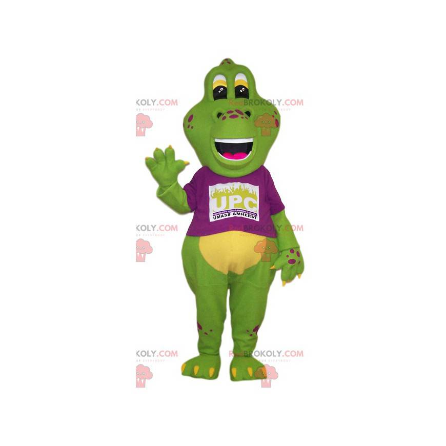 Mascota de lagarto verde grande con una camiseta fucsia -