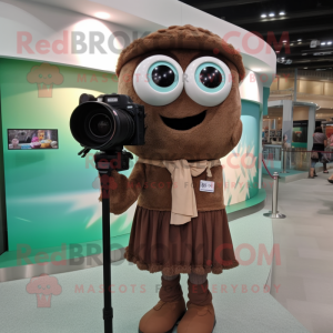 Brown Camera mascot costume character dressed with a Blouse and Eyeglasses