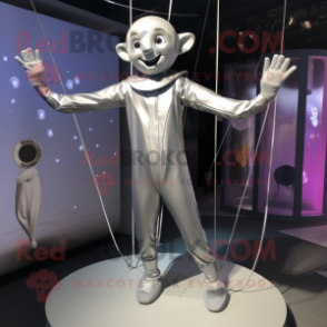 Silver Trapeze Artist mascot costume character dressed with a Jumpsuit and Earrings