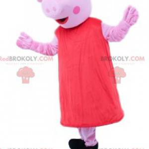 Mascote estranha criatura rosa com vestido vermelho -