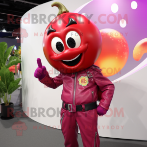 Magenta Tomato mascot costume character dressed with a Moto Jacket and Rings