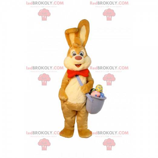 Easter bunny mascot with a basket of chocolate eggs -
