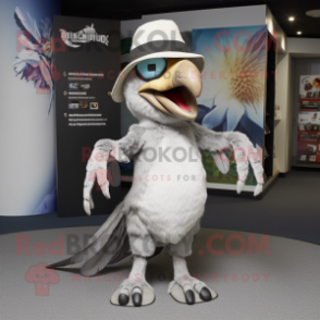 Silver Archeopteryx mascot costume character dressed with a Chinos and Hat pins