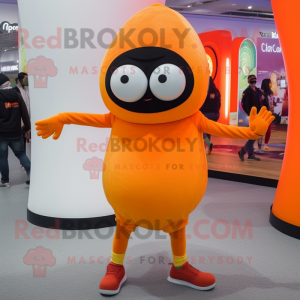 Orange Cyclops mascot costume character dressed with a Leggings and Berets