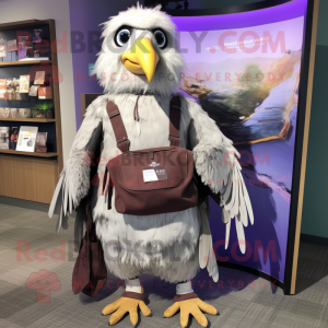 Lavender Haast'S Eagle mascot costume character dressed with a Vest and Tote bags
