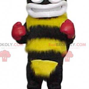 Gelbes und schwarzes Hummelmaskottchen mit Boxhandschuhen -