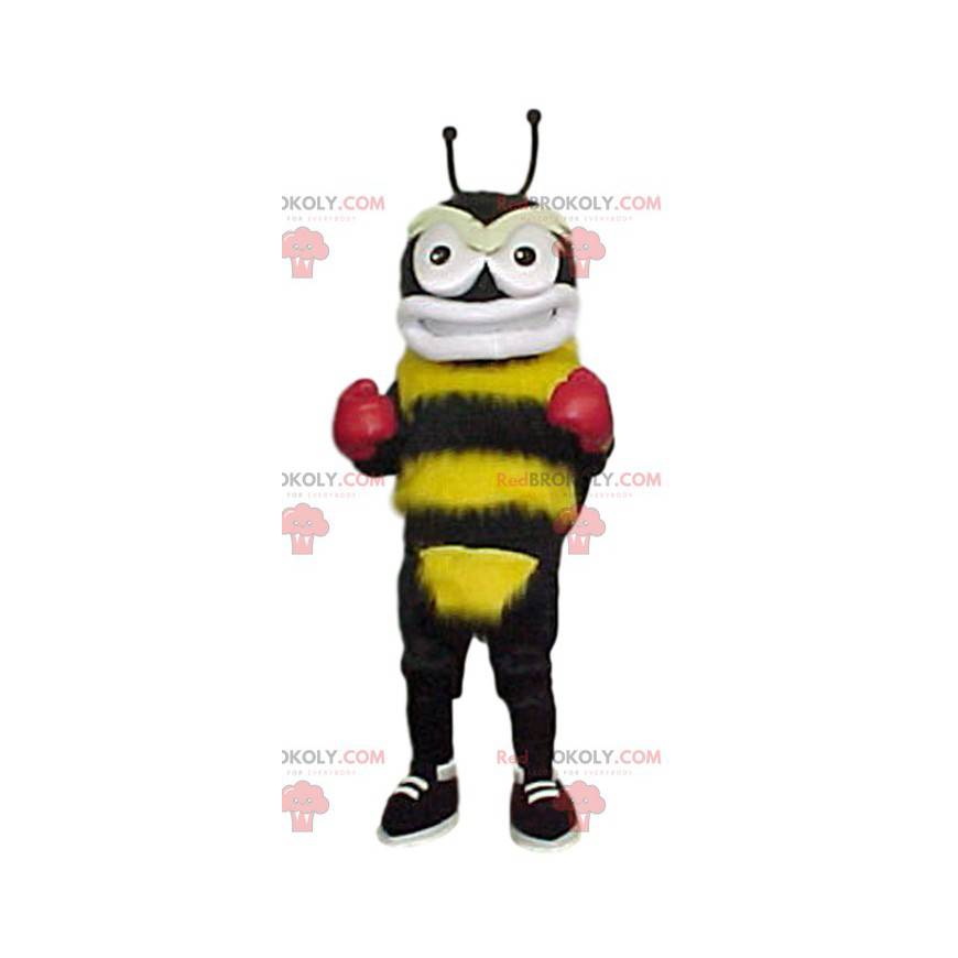 Mascota abejorro amarillo y negro con guantes de boxeo -
