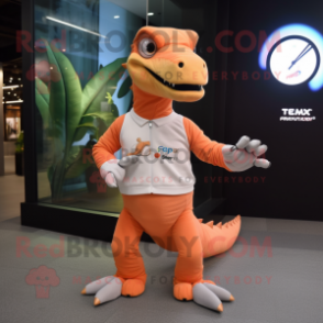 Peach Tyrannosaurus mascot costume character dressed with a Long Sleeve Tee and Smartwatches