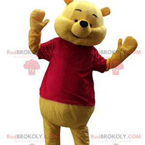 Winnie the Pooh mascot happy with his red t-shirt -