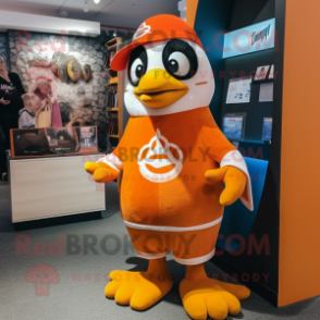 Orange Penguin mascot costume character dressed with a Blouse and Headbands