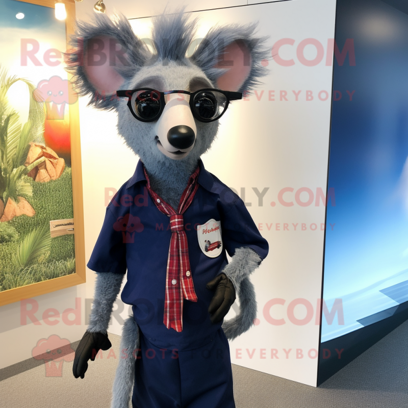 Navy Aye-Aye mascot costume character dressed with a Oxford Shirt and Earrings