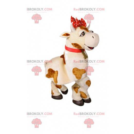 Mascotte mucca bianca e marrone con un fiocco rosso -