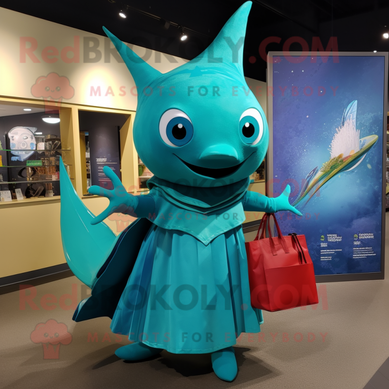 Turquoise Swordfish mascot costume character dressed with a Evening Gown and Tote bags