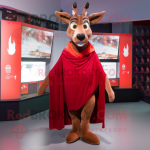 Red Roe Deer mascot costume character dressed with a Graphic Tee and Shawl pins