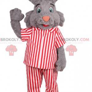 gray rabbit mascot with red and white striped pajamas -