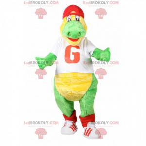 Mascota dinosaurio verde con una camiseta blanca para apoyar -