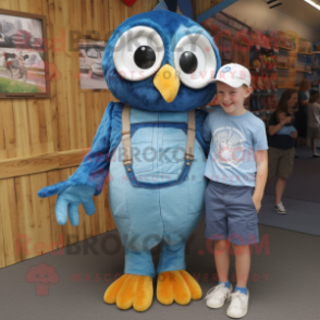 Blue Owl mascot costume character dressed with a Dungarees and Watches