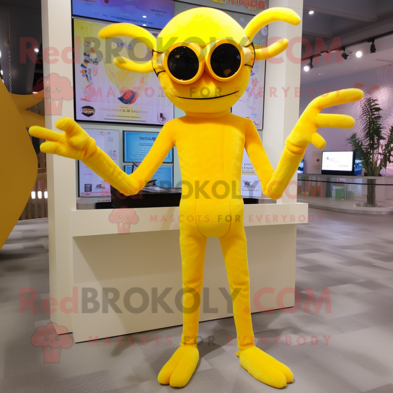 Yellow Spider mascot costume character dressed with a Jumpsuit and Reading glasses