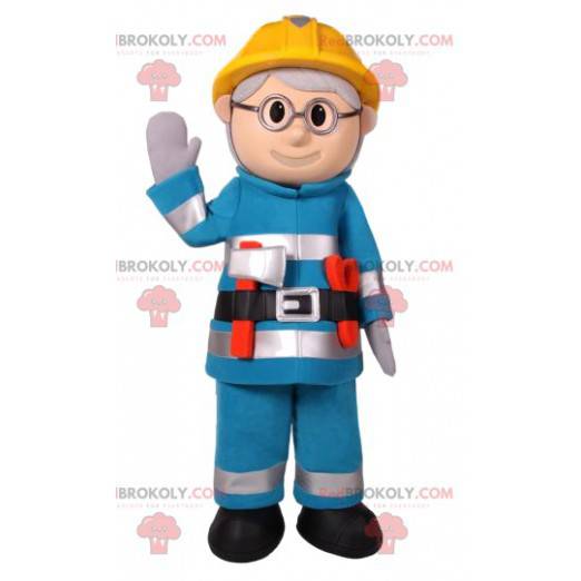 Construction snowman mascot in blue work clothes -