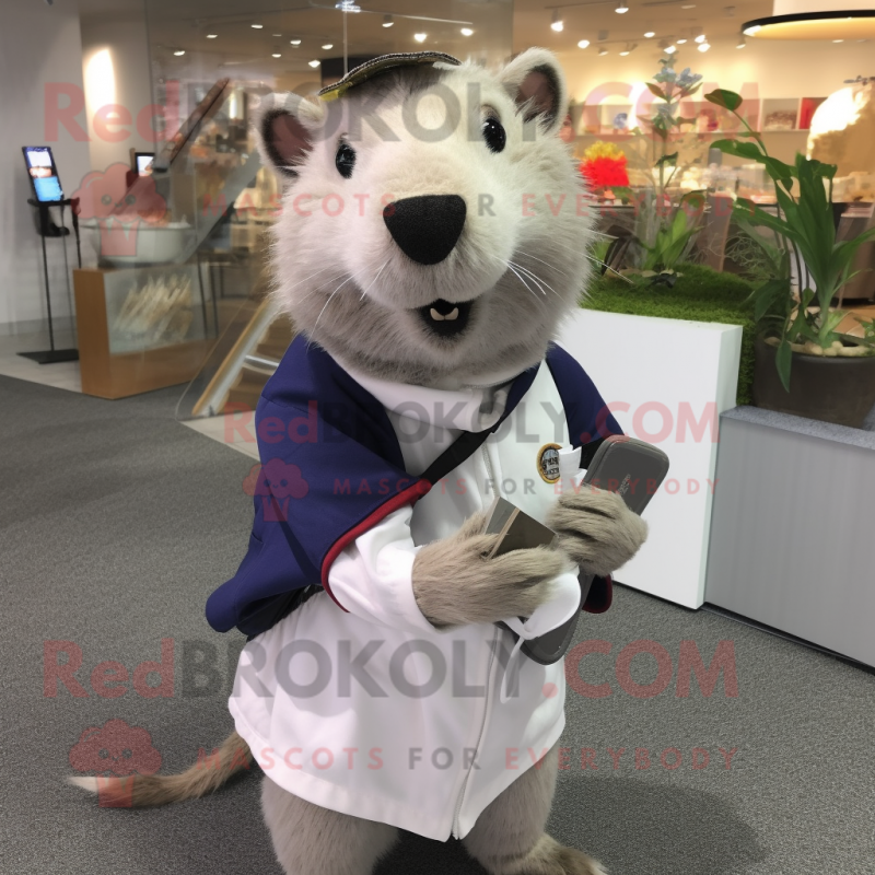 Silver Capybara mascot costume character dressed with a Polo Shirt and Shawl pins Silver Capybara mascot costume character dressed with a Polo Shirt and Shawl pins