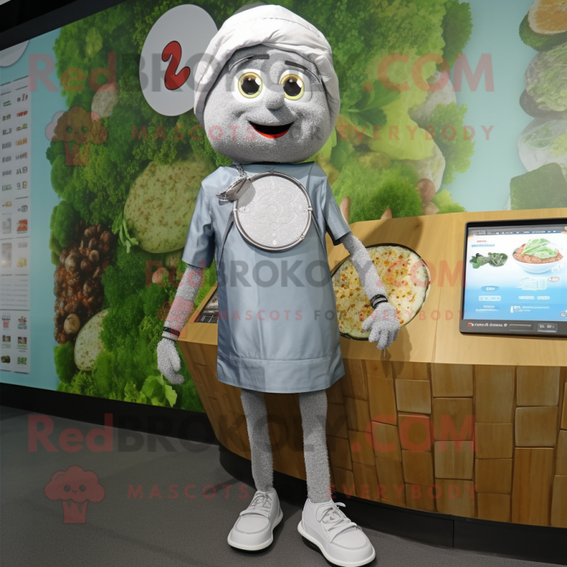 Silver Falafel mascot costume character dressed with a Denim Shorts and Digital watches