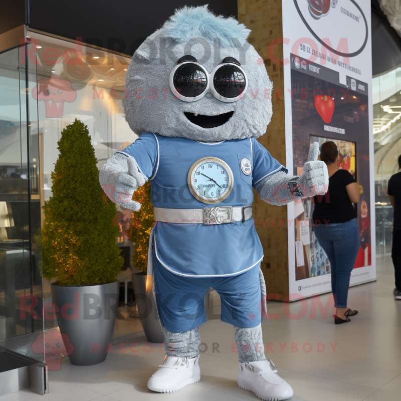 Silver Falafel mascot costume character dressed with a Denim Shorts and Digital watches