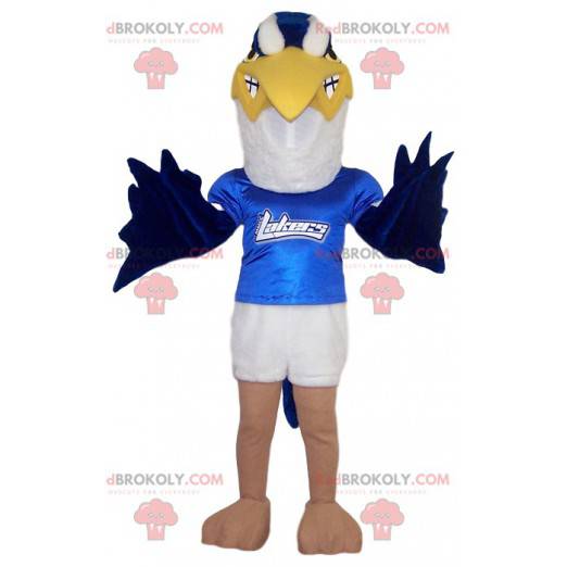 Mascota águila dorada blanca y azul con su camiseta azul -