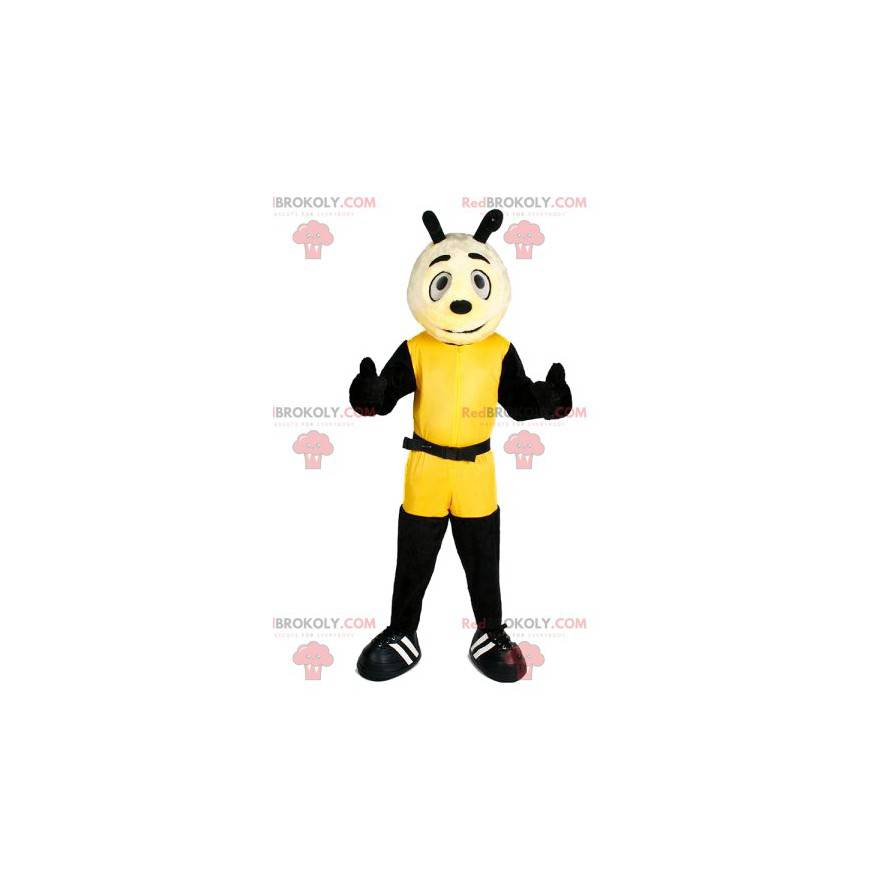 Liten hundmaskot i gul sportkläder - Redbrokoly.com