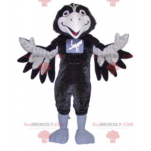 Mascote corvo preto e branco muito sorridente - Redbrokoly.com