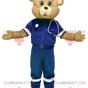 Mascote do urso da areia em uniforme de primeiros socorros -
