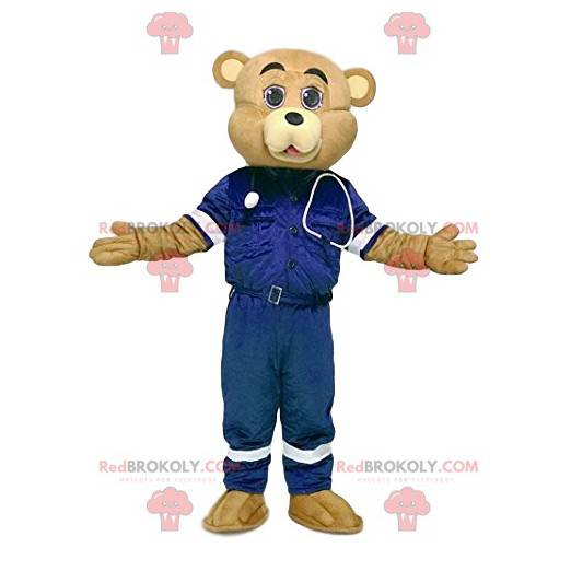 Mascota de oso de arena en traje de primeros auxilios -