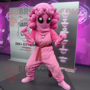 Pink Medusa mascot costume character dressed with a Hoodie and Belts