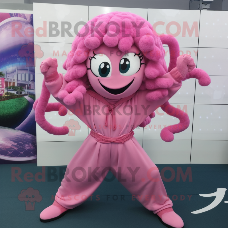 Pink Medusa mascot costume character dressed with a Hoodie and Belts