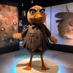 Tan Blackbird mascot costume character dressed with a Playsuit and Bow ties