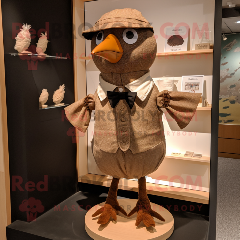 Tan Blackbird mascot costume character dressed with a Playsuit and Bow ties Tan Blackbird mascot costume character dressed with a Playsuit and Bow ties
