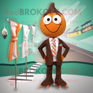 Brown Aglet mascot costume character dressed with a Swimwear and Tie pins