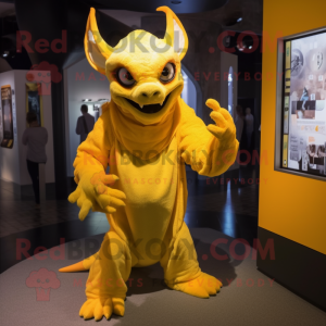Yellow Gargoyle mascot costume character dressed with a Cover-up and Mittens
