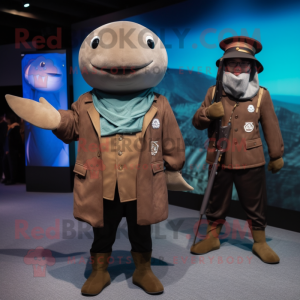 Brown Narwhal mascot costume character dressed with a Jacket and Berets