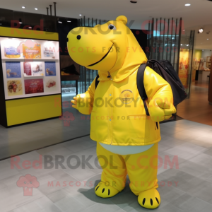 Yellow Hippopotamus mascot costume character dressed with a Jacket and Messenger bags