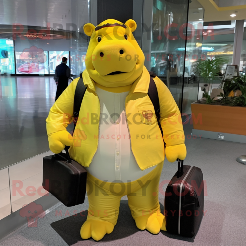 Yellow Hippopotamus mascot costume character dressed with a Jacket and Messenger bags