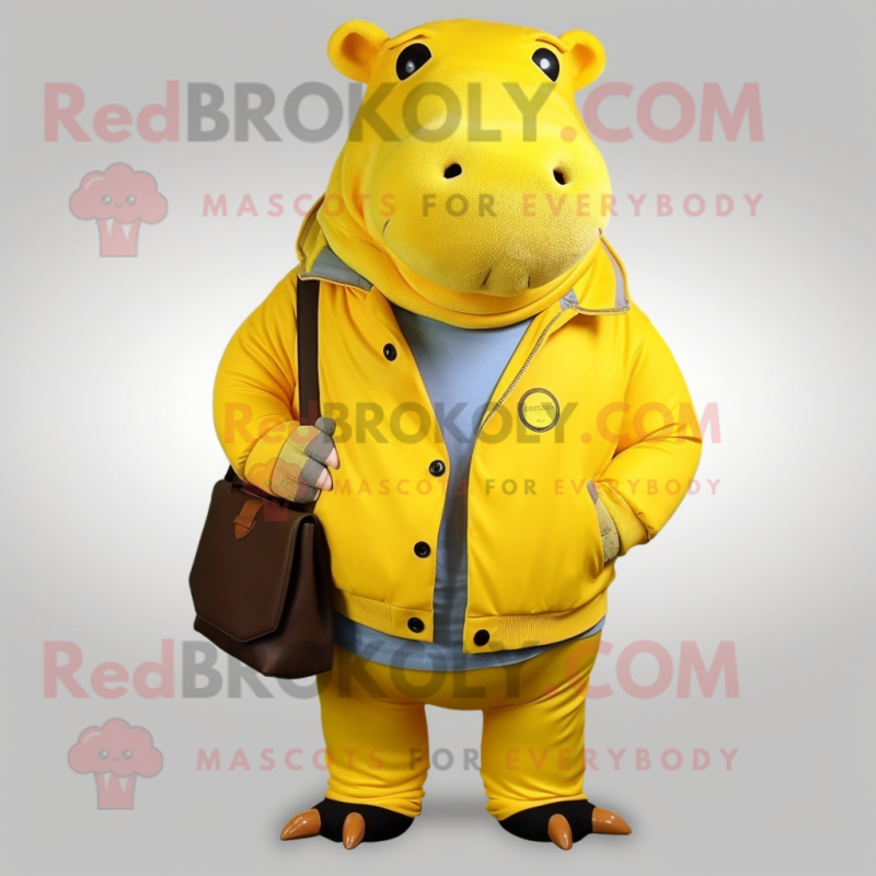 Yellow Hippopotamus mascot costume character dressed with a Jacket and Messenger bags