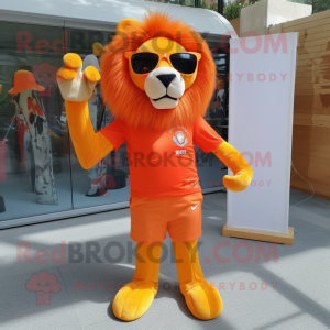 Orange Lion mascot costume character dressed with a Empire Waist Dress and Sunglasses