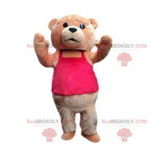 Brun bjørnemaskot med en fuchsia-lyserød t-shirt -