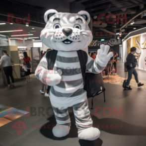 Silver Tiger mascot costume character dressed with a Bodysuit and Backpacks