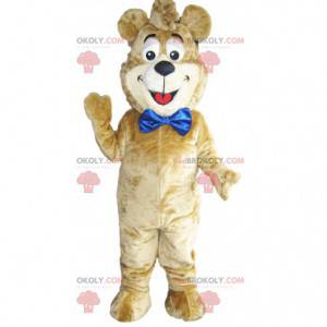 Mascotte d'ours beige avec un gros nœud bleu. Costume d'ours -