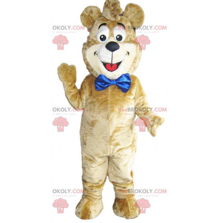 Beige Bär Maskottchen mit einer großen blauen Schleife.