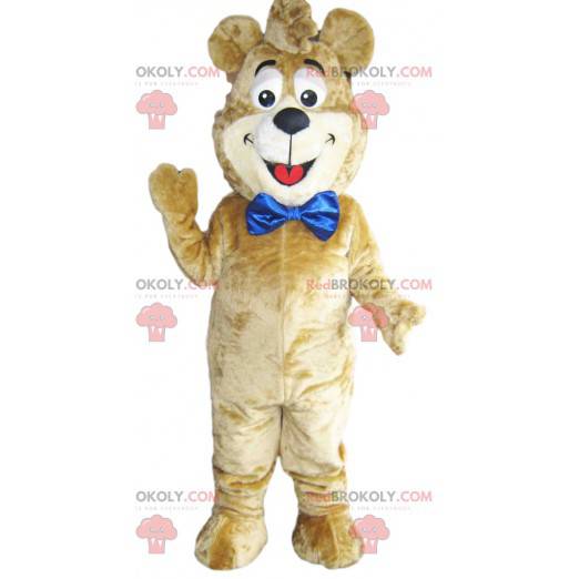 Beige Bär Maskottchen mit einer großen blauen Schleife.