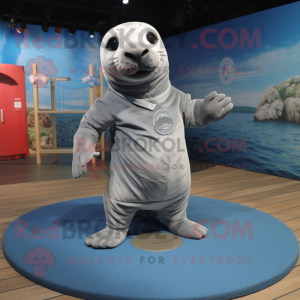 Gray Seal mascot costume character dressed with a Polo Tee and Foot pads