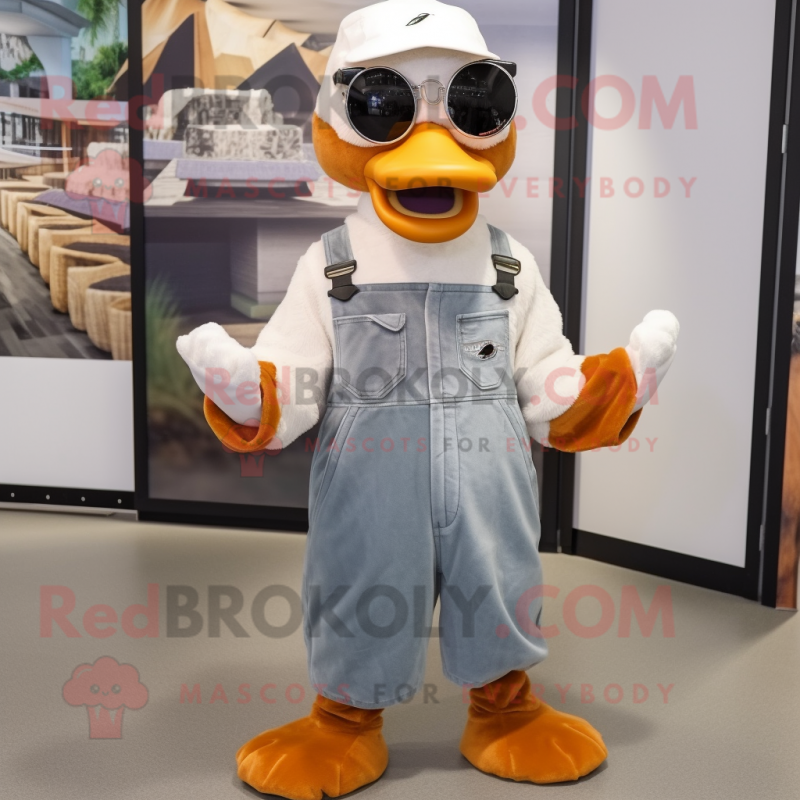 Rust Swan mascot costume character dressed with a Dungarees and Sunglasses