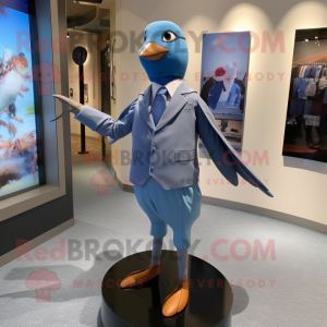 Blue Passenger Pigeon mascot costume character dressed with a Playsuit and Tie pins